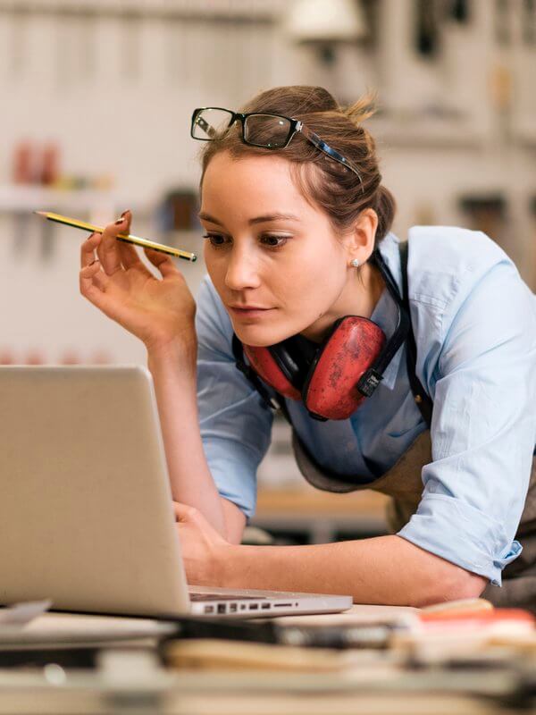 Young businesswoman looking at a laptop