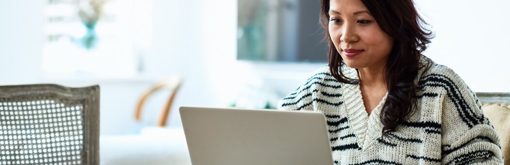 Woman using laptop and working from home