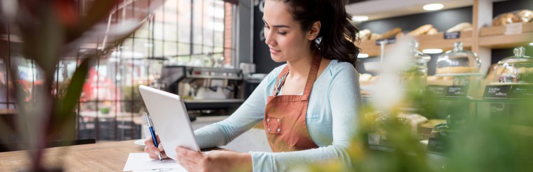 Woman doing the books at a restaurant