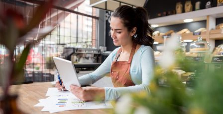 Woman doing the books at a restaurant