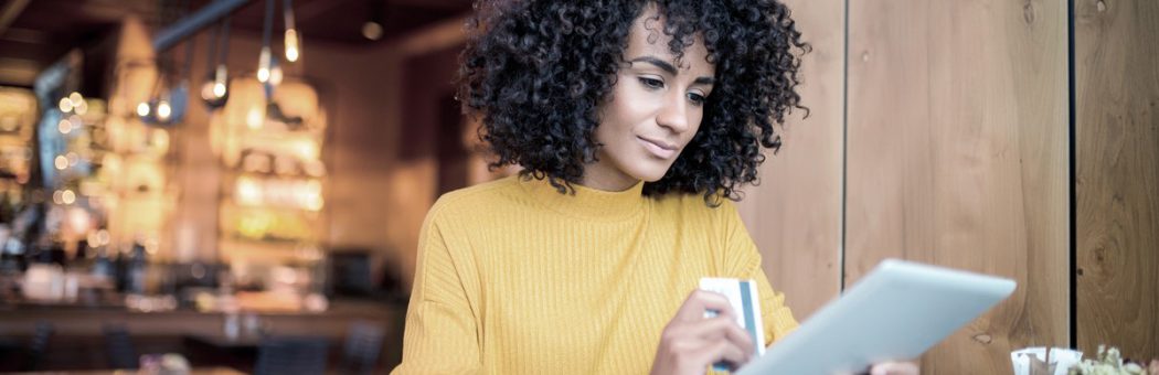 Woman using tablet for online banking