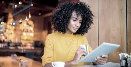 Woman using tablet for online banking