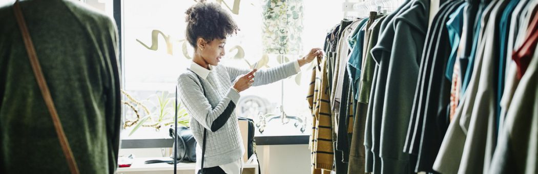 Woman taking photo of clothes