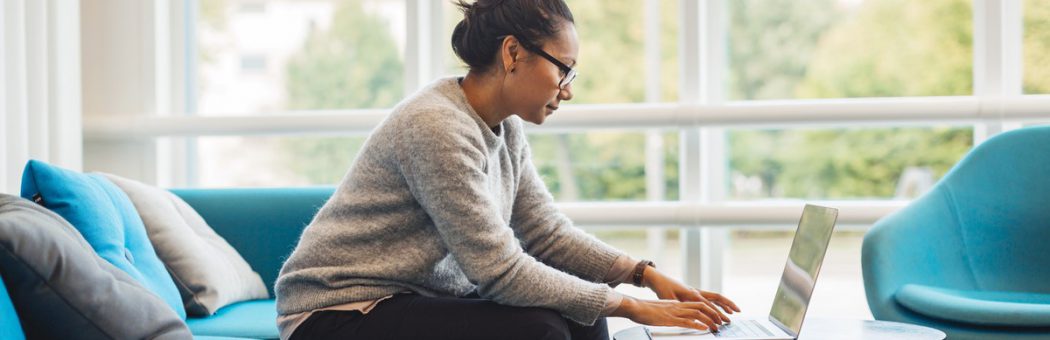 Woman writing an email on a computer