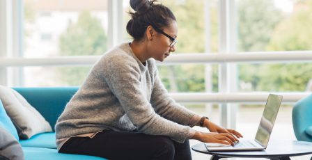 Woman writing an email on a computer