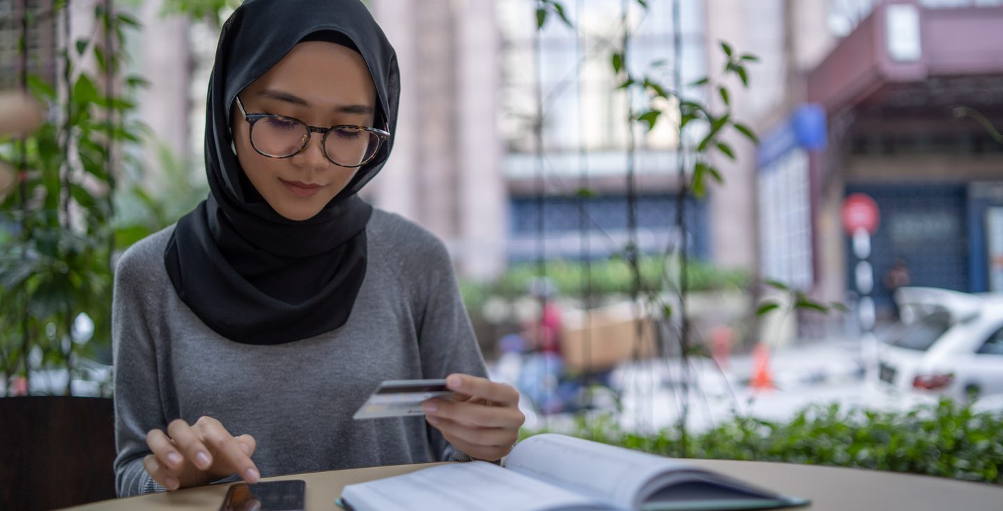 Woman making credit card purchase