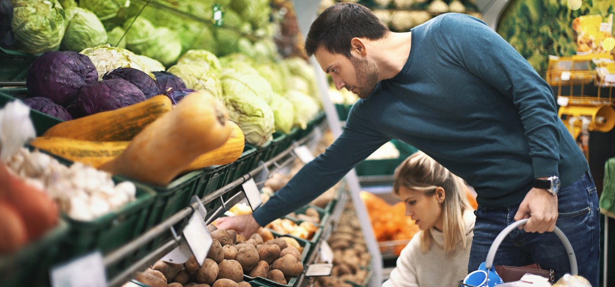 Man buying fruit and vegetables in a supermarket