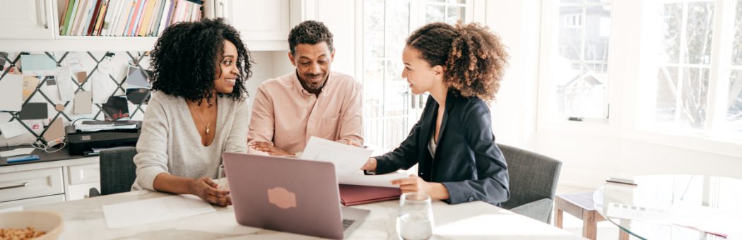 Couple speaking to their accountant.