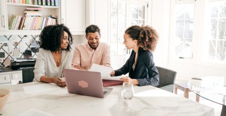 Couple speaking to their accountant.