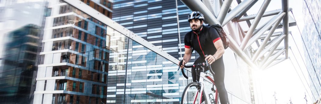 Cyclist riding along a bridge