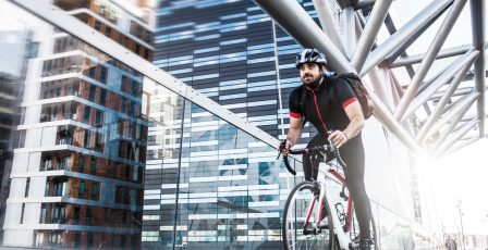 Cyclist riding along a bridge