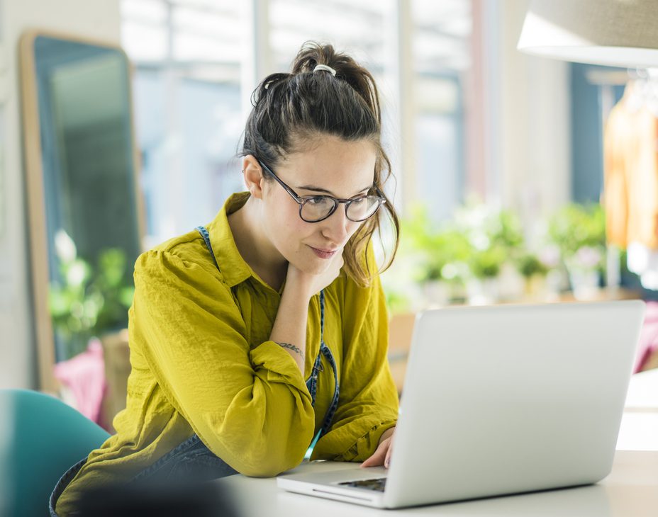 Young businesswoman working at her laptop