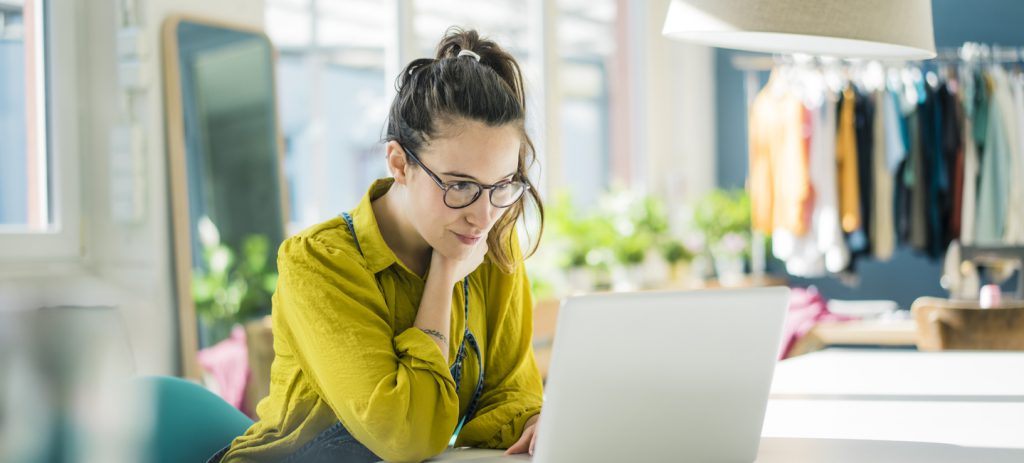 Young businesswoman working at her laptop