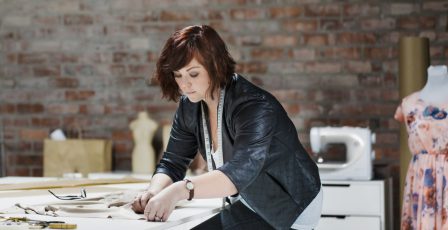 Young fashion designer working on an order