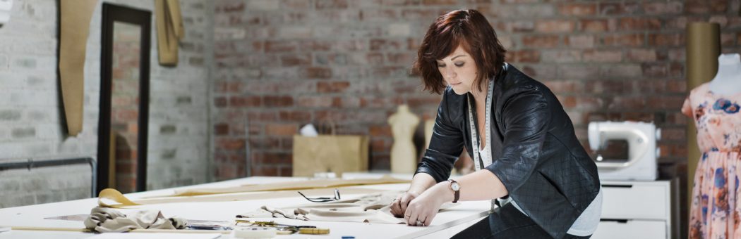 Young fashion designer working on an order