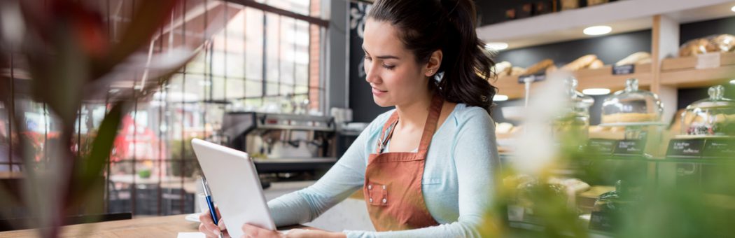 Woman doing the books at a restaurant