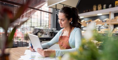 Woman doing the books at a restaurant