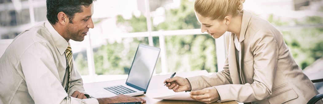 Businesswoman signing contract at interview