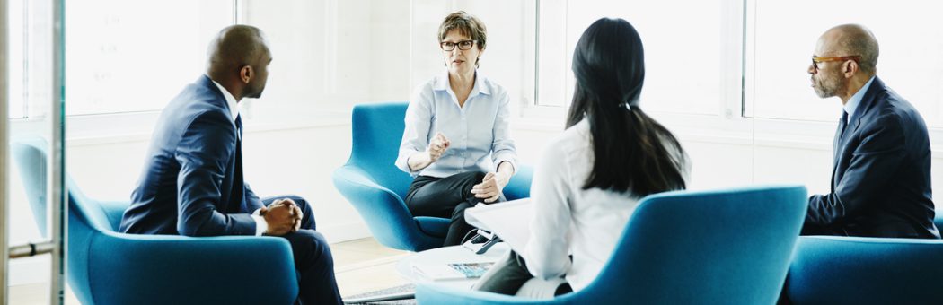 Businesswoman leading meeting in office