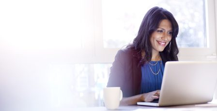 Young business woman working on a laptop.