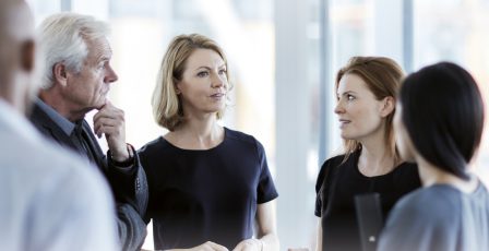 Business people talking in lobby