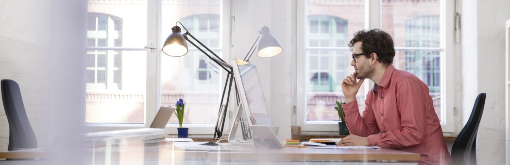 Man sitting at a desk while working from home