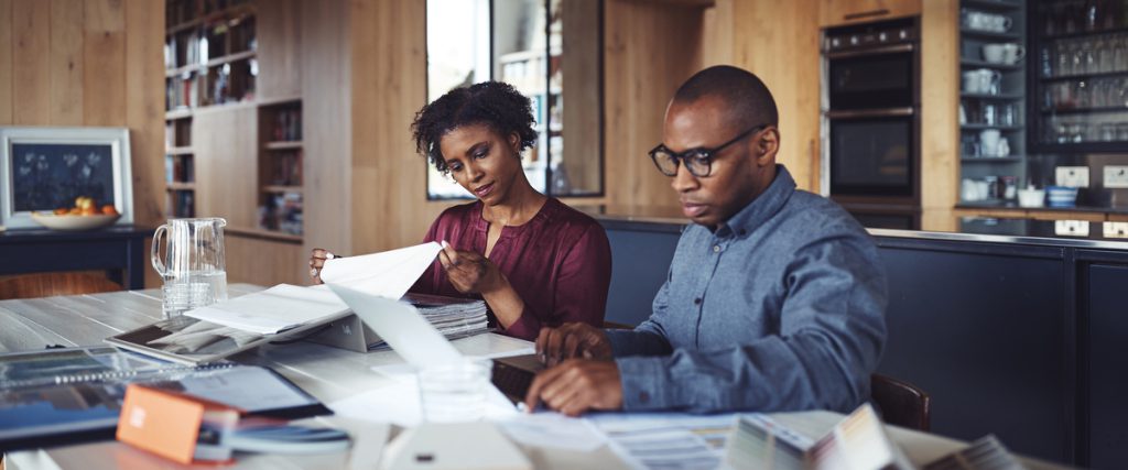 Couple looking through their bills