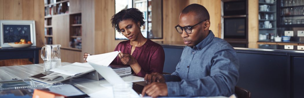 Couple looking through their bills