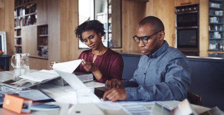 Couple looking through their bills