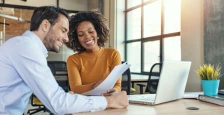 Two colleagues looking at a marketing plan