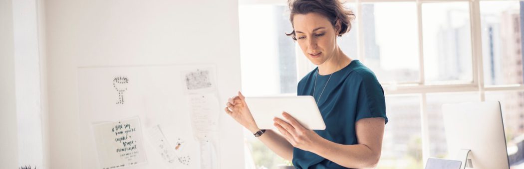 Person using a tablet for age verification checks