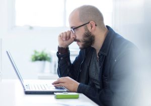 Man looking at his computer