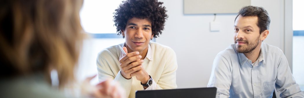 A financial services team talking in a meeting room