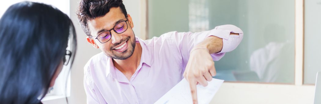 Man showing documents to a customer