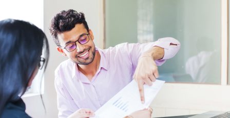 Man showing documents to a customer