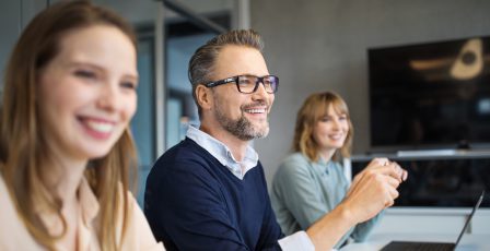 Group of professionals working together in office