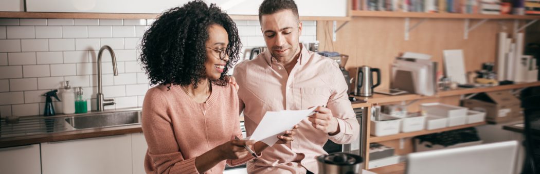 Couple planning their finances in the kitchen