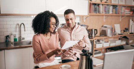 Couple planning their finances in the kitchen