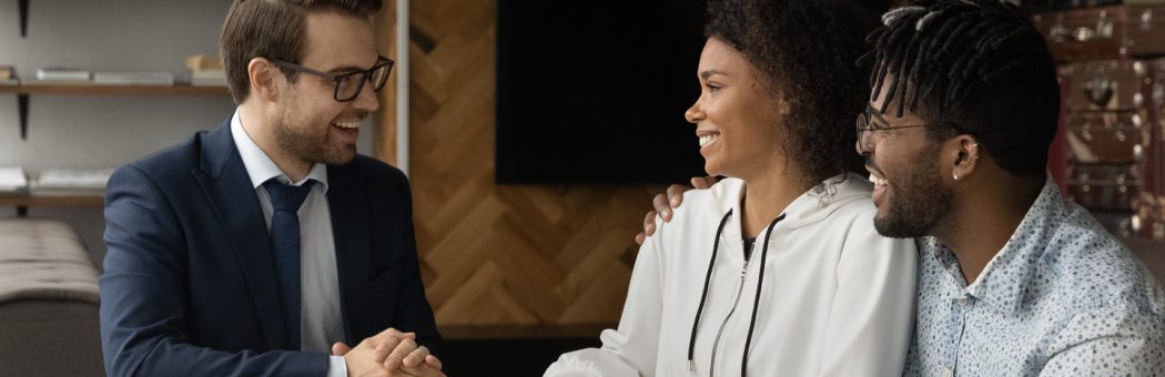 Young couple talking to a financial adviser