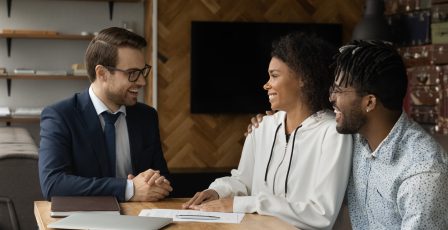 Young couple talking to a financial adviser