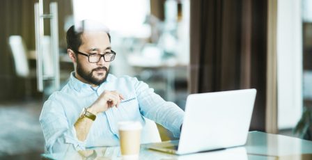 Businessman looking at laptop display at workplace