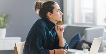 Consumer shopping online with her credit card