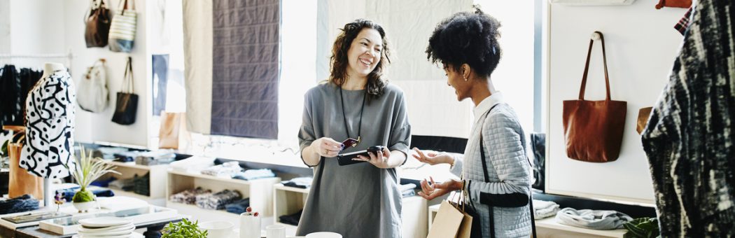 Small business owner completing transaction with a customer