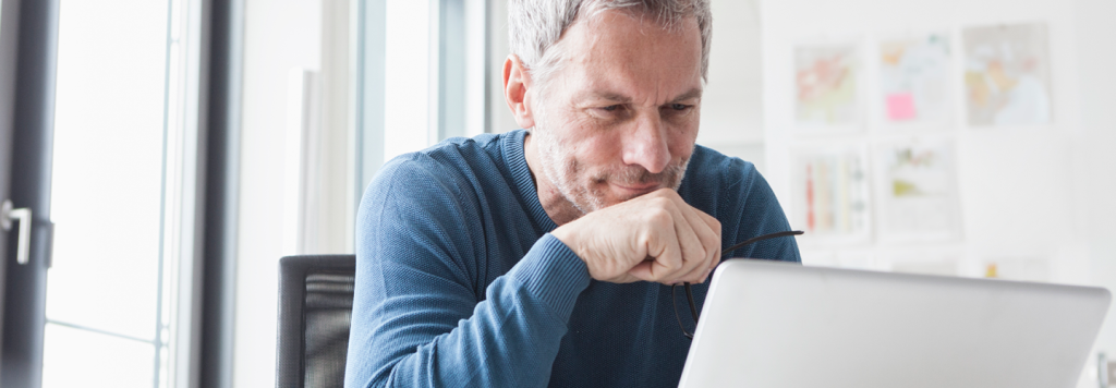 Mature man using a laptop