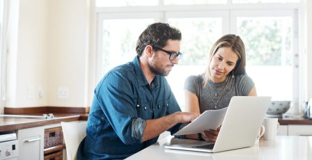 A couple checking over their energy bills