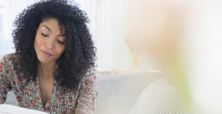 Woman looking at bills