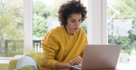 Woman using her laptop to shop online