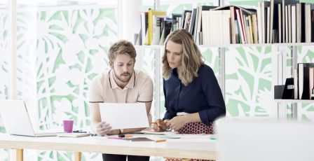 Work colleagues reviewing job applicants