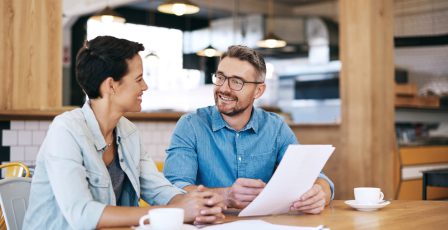 Small business owners going through paperwork