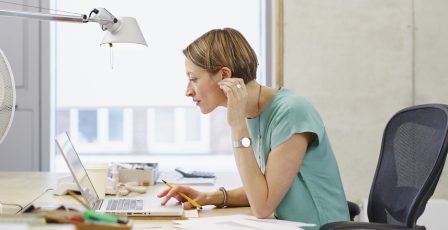 Businesswoman looking at her customer database